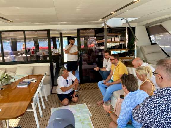 Captain Evan explains itinerary onboard Catamaran Alexandra II, at the East Med Yacht Show in Poros 2024