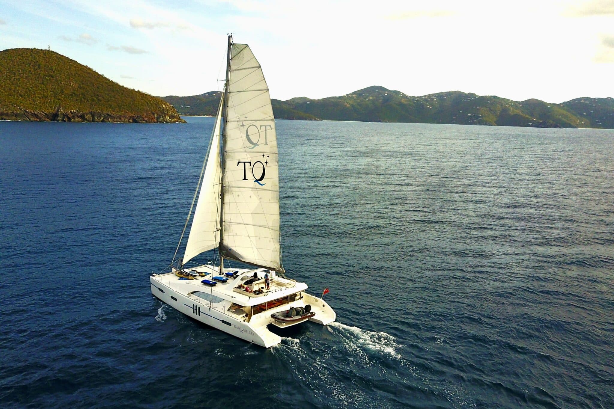 Crewed catamaran under sail