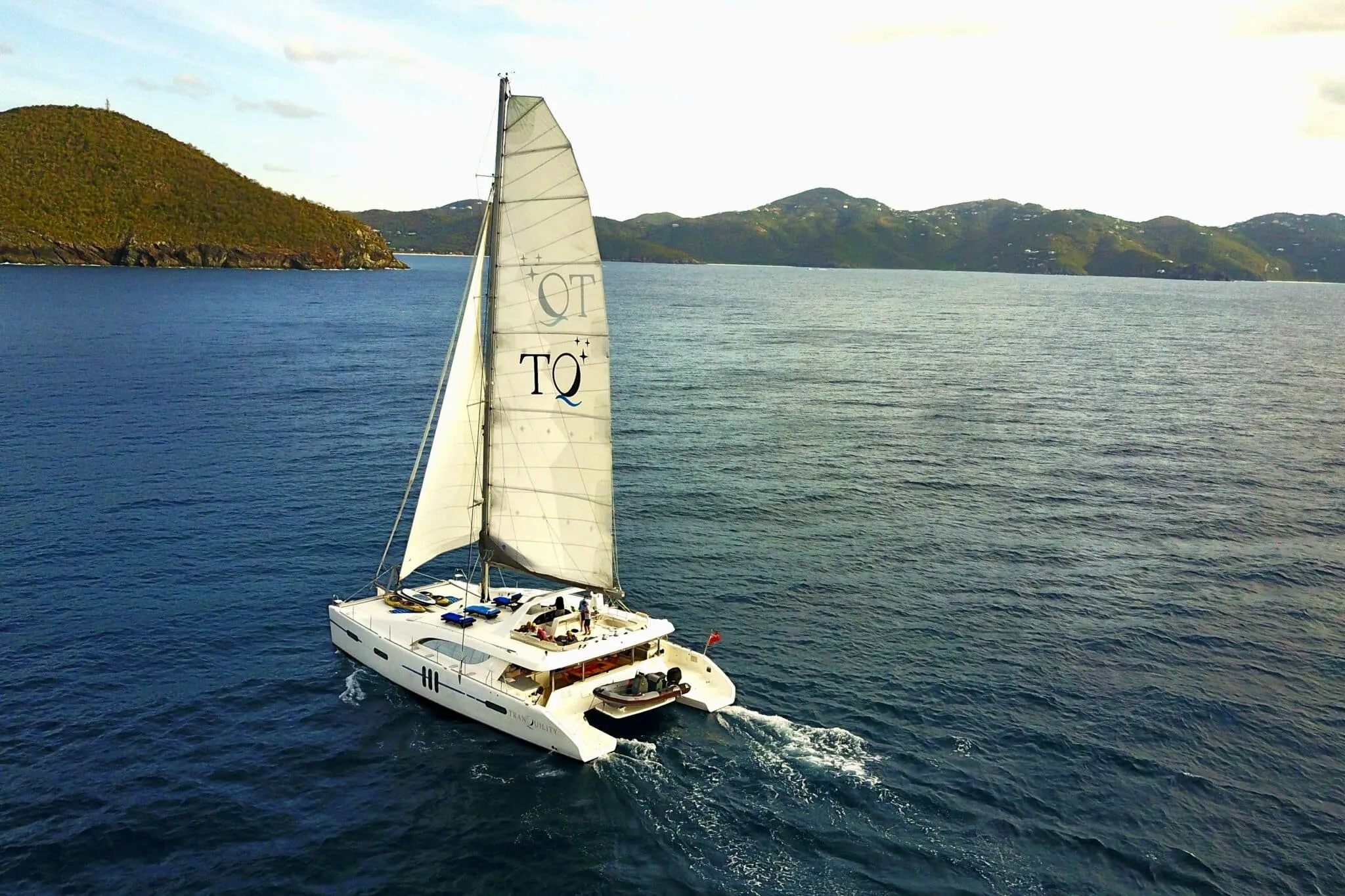 Crewed catamaran under sail