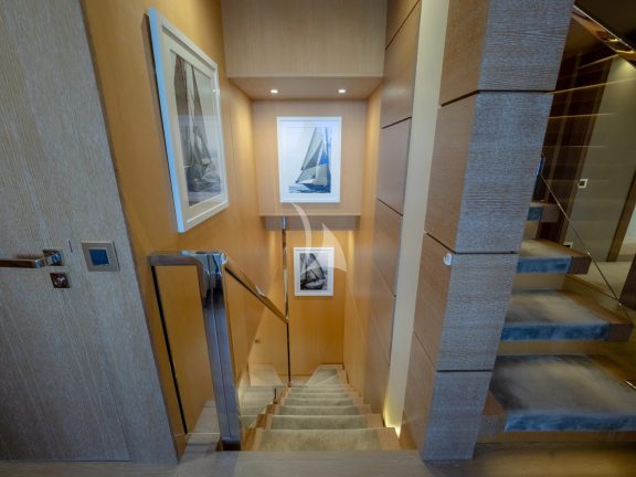 Staircase to lower deck convertible cabins
